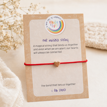 Load image into Gallery viewer, Emily & Eve invisible string worry bracelet with gold heart charm on comfort card for children