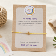 Load image into Gallery viewer, Emily &amp; Eve invisible string worry bracelet with gold star charm on comfort card for children
